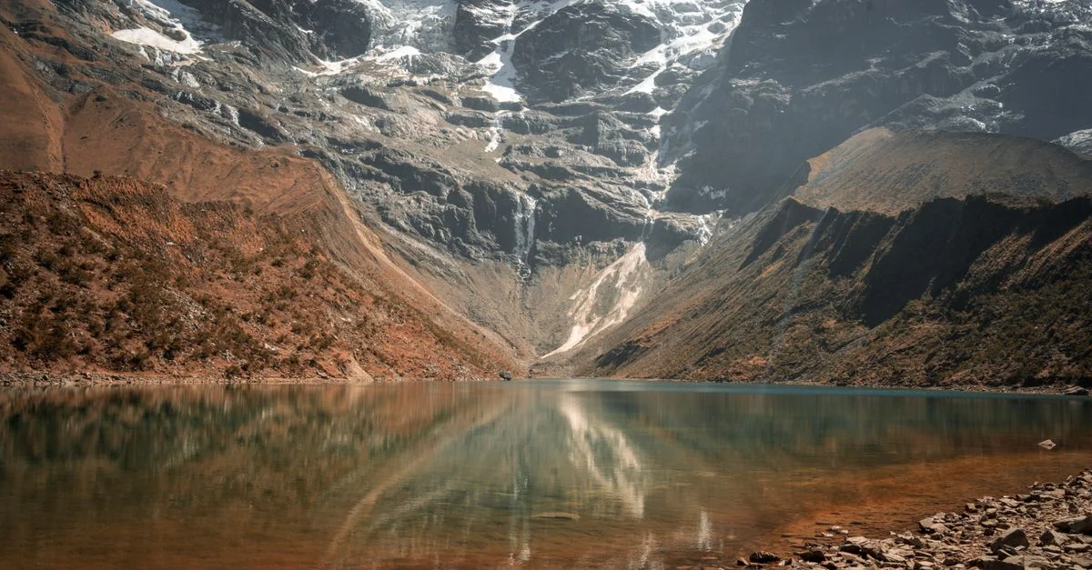 Stunning view of the turquoise Humantay Lake nestled in the Andes, Peru.