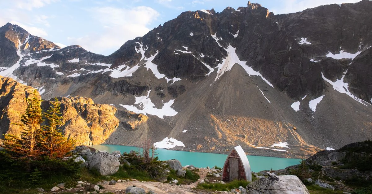 Captivating view of Joffre Lakes with snowy mountains and turquoise water in British Columbia.